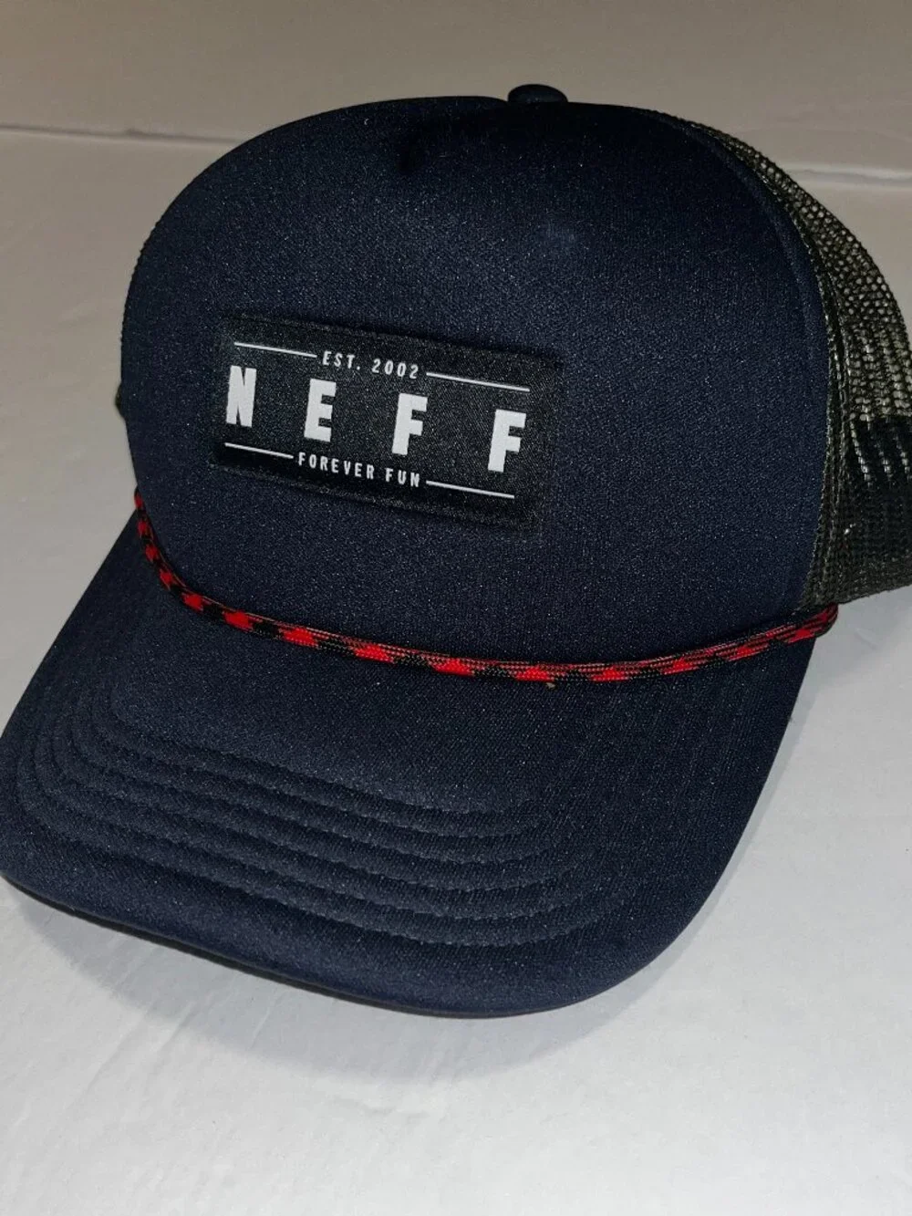Navy blue NEFF trucker cap with red and black checkered trim #skater #trucker